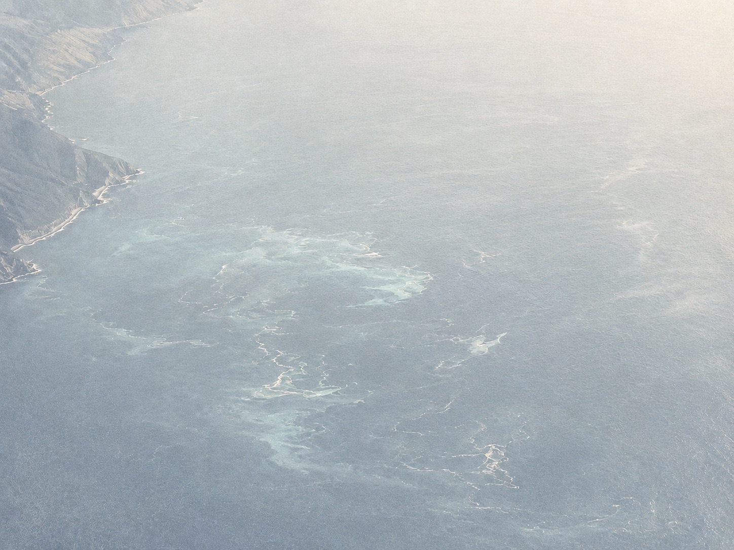 Aerial view of ocean currents along a coastline